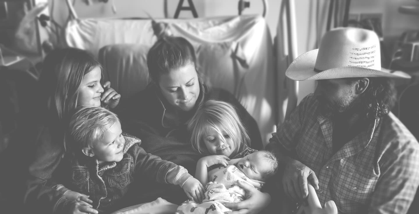 Black and white photo of a family with three children on a couch, with text overlay 'Family update nobody's prepared to give.